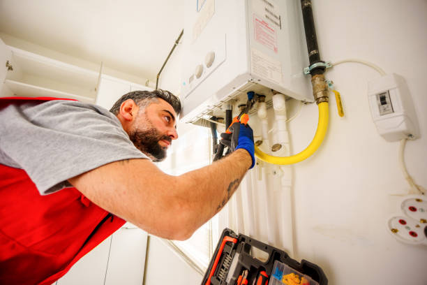 Technician servicing a water heater